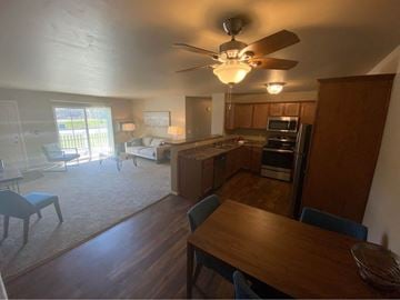 Appleton apartment for rent - an open kitchen and living room with a wooden table