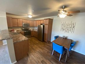 Appleton apartment for rent - a kitchen and dining area with a table and a refrigerator