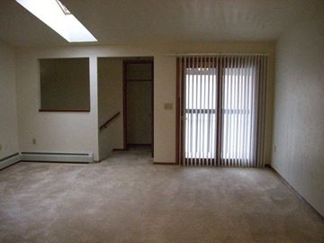 Green Bay apartment for rent - an empty living room with a sliding glass door