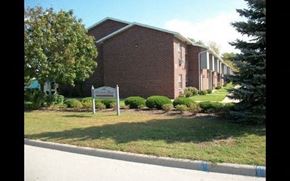 Green Bay apartment for rent - a building with a sign in front of it