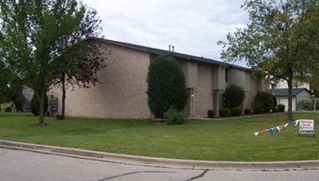 Green Bay apartment for rent - a church building with a kite in the grass