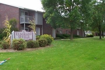 Green Bay apartment for rent - a sign in the grass in front of an apartment building