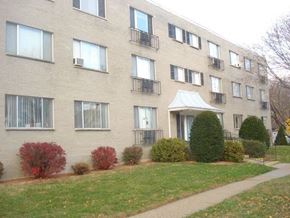 Ft. Atkinson apartment for rent - a brick apartment building with a sidewalk in front of it