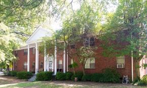 Memphis apartment for rent - a red brick house with trees in front of it