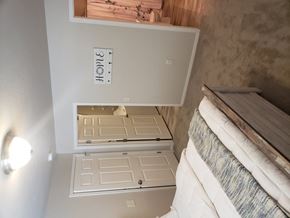 Denmark apartment for rent - A white cabinet with a mirror on top of it.