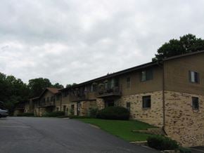 West Bend apartment for rent - a row of buildings with balconies on the side of a street