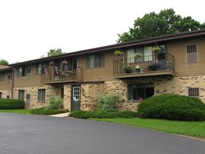 West Bend apartment for rent - a building with two balconies and a street in front of it