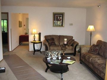 West Bend apartment for rent - a living room with couches and a coffee table