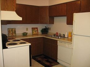 West Bend apartment for rent - a kitchen with a stove refrigerator and a sink