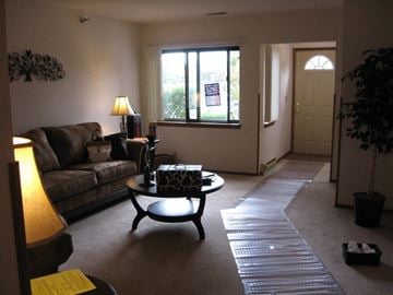 West Bend apartment for rent - a living room with a couch and a table
