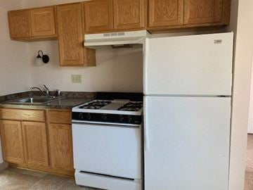 St. Francis apartment for rent - a kitchen with a stove and a refrigerator
