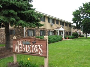 West Bend apartment for rent - the meadows resort and spa sign in front of a building