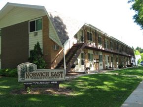 St. Francis apartment for rent - a large building with a sign in front of it