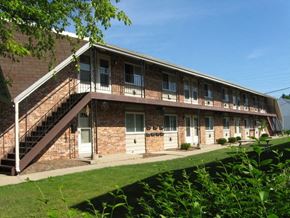 St. Francis apartment for rent - a brick apartment building with stairs and a balcony