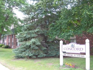 Menomonee Falls apartment for rent - a church sign in front of a brick building