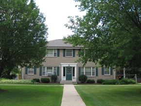Menomonee Falls apartment for rent - a brick house with a lawn in front of it
