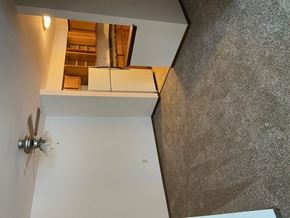 Waukesha apartment for rent - a view of a room from the top of a staircase