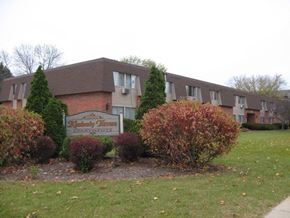 Waukesha apartment for rent - an apartment building with a sign in front
