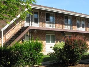 St. Francis apartment for rent - the front of a brick building with stairs and a balcony