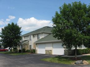 Watertown apartment for rent - a white house with trees in front of it