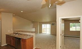 Plymouth apartment for rent - an empty living room with a kitchen with a sink