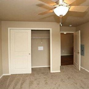 Plymouth apartment for rent - an empty bedroom with a ceiling fan and a closet