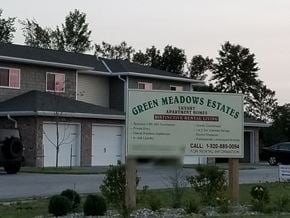 Sheboygan apartment for rent - a sign for green meadows estates is shown in front of a house