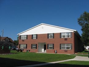 Sheboygan apartment for rent - a red brick house with a white roof