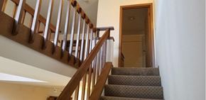 Milwaukee apartment for rent - a staircase in a house with stairs and a door