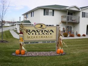 Sheboygan Falls apartment for rent - a sign in front of a house with pumpkins on it