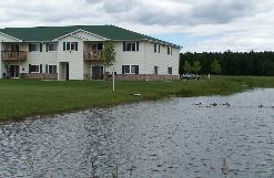 Shawano apartment for rent - the building where the hotel is located is next to a pond