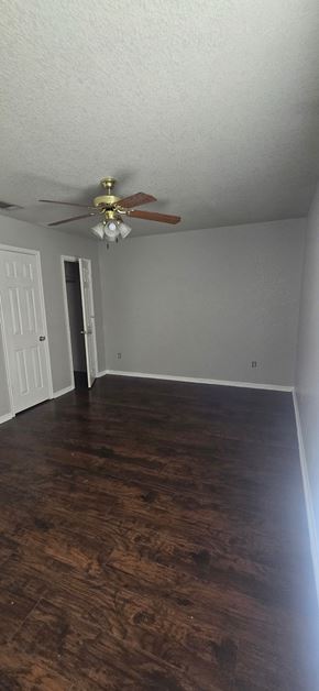 Copperas Cove apartment for rent - A room with a ceiling fan and wooden floors.
