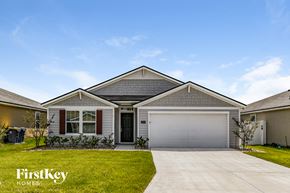 Jacksonville house for rent - A house with a garage and a driveway is shown with the words "FirstKey Homes" on the bottom left.