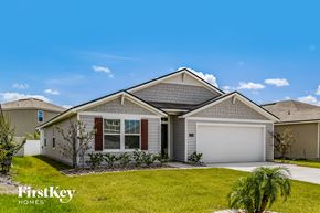 Jacksonville house for rent - A house with a garage and a driveway is for sale.