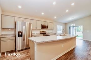 Zephyrhills house for rent - a kitchen with white cabinets and a white counter top
