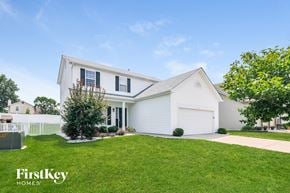 St Peters house for rent - a white house with a lawn in front of it