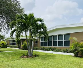 North Miami Beach apartment for rent - a palm tree in front of a building