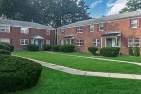 Albany townhouse for rent - a sidewalk in front of a brick apartment building
