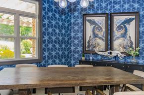 Clifton Park apartment for rent - a dining room with a wooden table and chairs and blue wallpaper