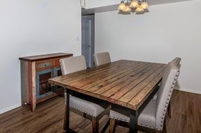 Ithaca apartment for rent - a dining room with a wooden table and chairs
