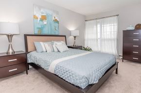 Ithaca apartment for rent - a bedroom with a bed and two dressers