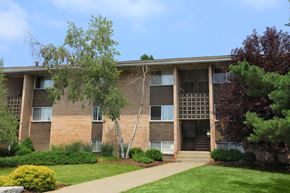 Ithaca apartment for rent - an apartment building with a lawn and trees