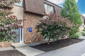Ithaca apartment for rent - a side view of a building with a tree in front of it