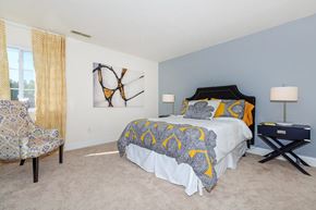 Ithaca apartment for rent - a bedroom with a bed and a chair