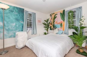 Ithaca apartment for rent - a bedroom with a bed and plants in it