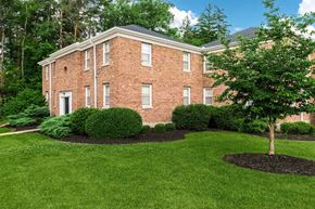 Ithaca apartment for rent - a large brick house with a tree in front of it