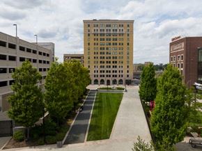 Detroit apartment for rent - an empty parking lot in front of a tall building
