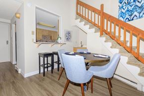 Saratoga Springs apartment for rent - a dining room with a table and chairs and a staircase