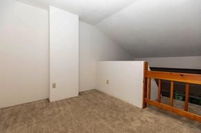Saratoga Springs apartment for rent - the upstairs bedroom has a loft with a bed and carpet