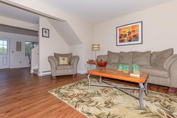 Troy apartment for rent - a living room with a couch and a table